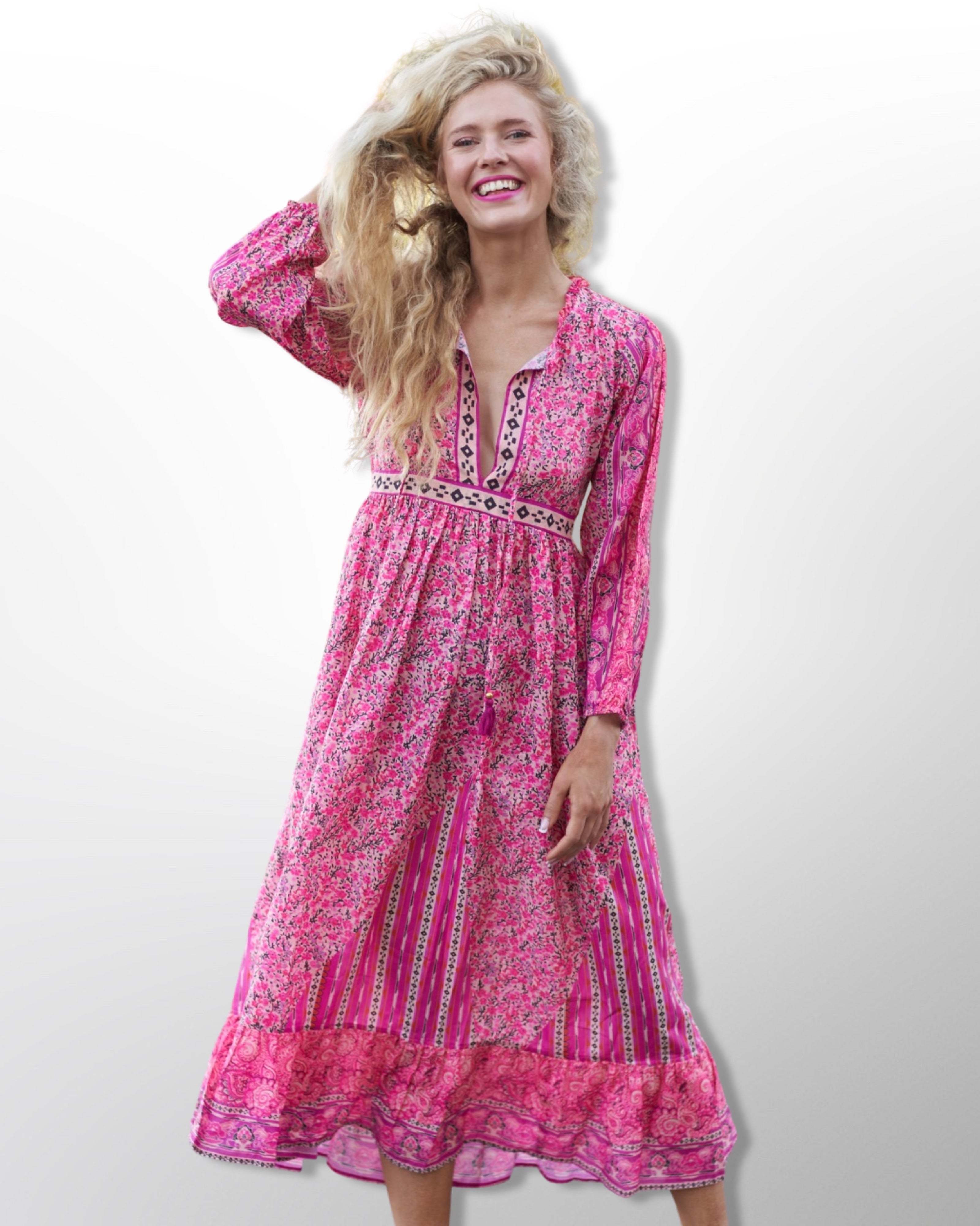 Say Hello to Our Comfy Floral Maxi Dress in Gorgeous Pink Hues , Meets slightly above the ankle with Balloon Sleeves , giving it that fun Bohemian Vibe  . It’s Flowy and Flirty , Light and Breezy , and Oh So Comfy . Tie Up Strings at the Collar and Below the Bust , make it for Easy Adjustability . Handmade With Love .  100% Cotton  Wash Separately in Cold Water   Iron On Low  Do Not Bleach   Made in India 