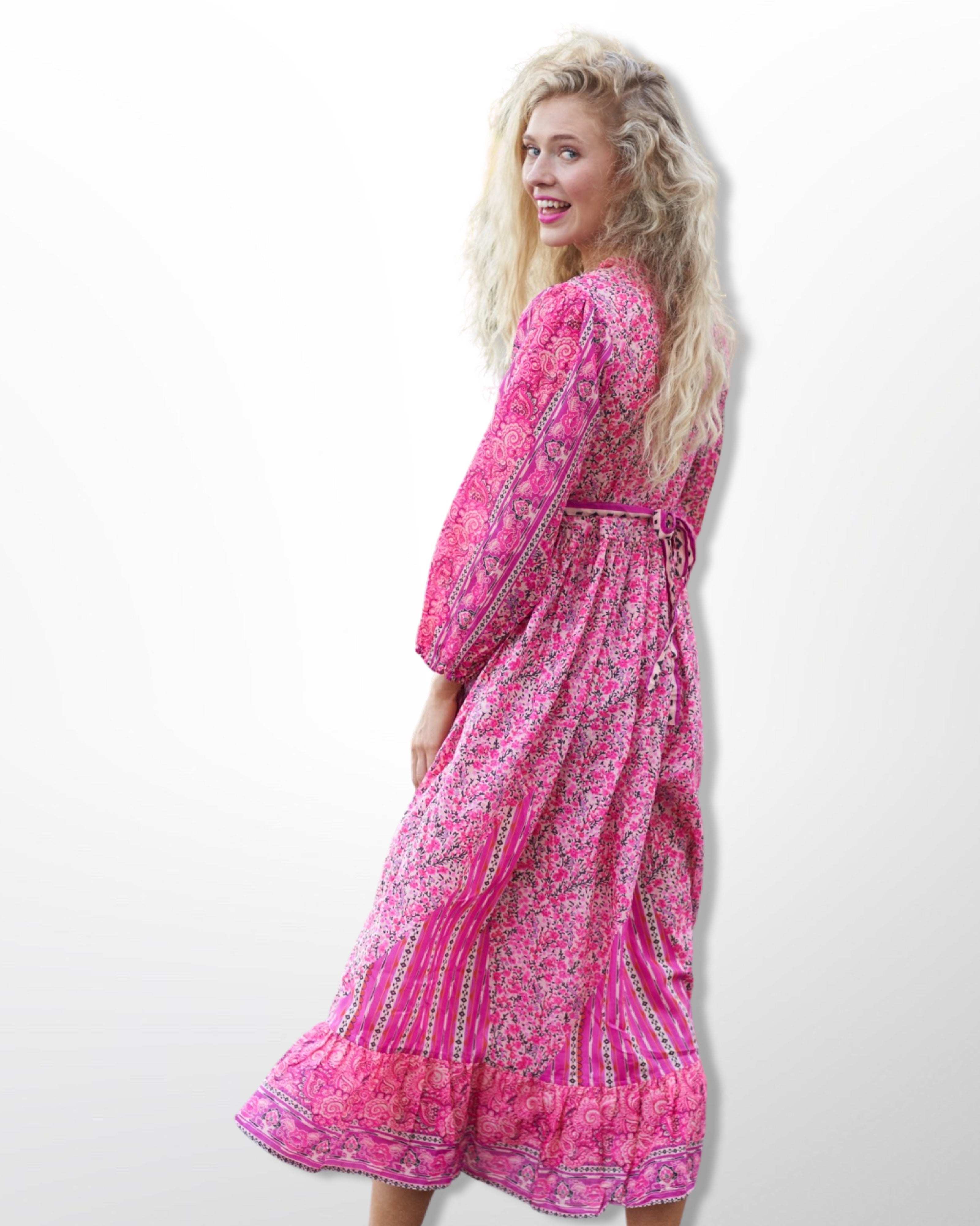 Say Hello to Our Comfy Floral Maxi Dress in Gorgeous Pink Hues , Meets slightly above the ankle with Balloon Sleeves , giving it that fun Bohemian Vibe  . It’s Flowy and Flirty , Light and Breezy , and Oh So Comfy . Tie Up Strings at the Collar and Below the Bust , make it for Easy Adjustability . Handmade With Love .  100% Cotton  Wash Separately in Cold Water   Iron On Low  Do Not Bleach   Made in India 
